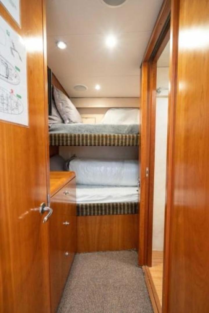 a room with a bed and a door aboard DANIELLE Yacht for Sale