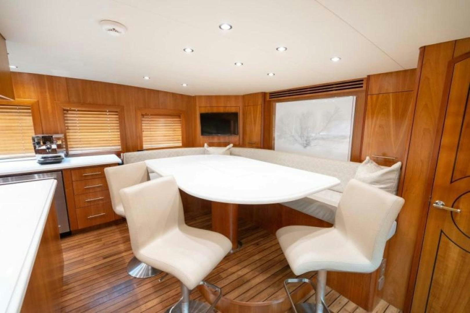 a kitchen with a dining table aboard DANIELLE Yacht for Sale