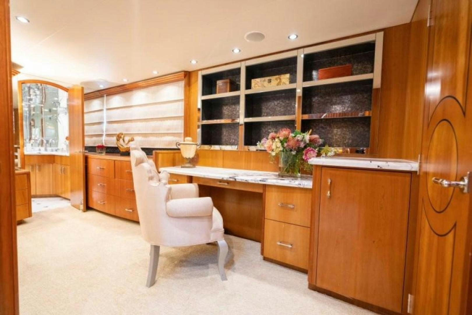 a kitchen with a white chair aboard DANIELLE Yacht for Sale