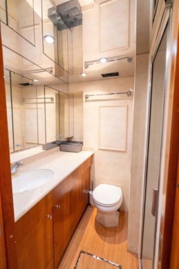 a bathroom with a toilet and sink aboard DANIELLE Yacht for Sale