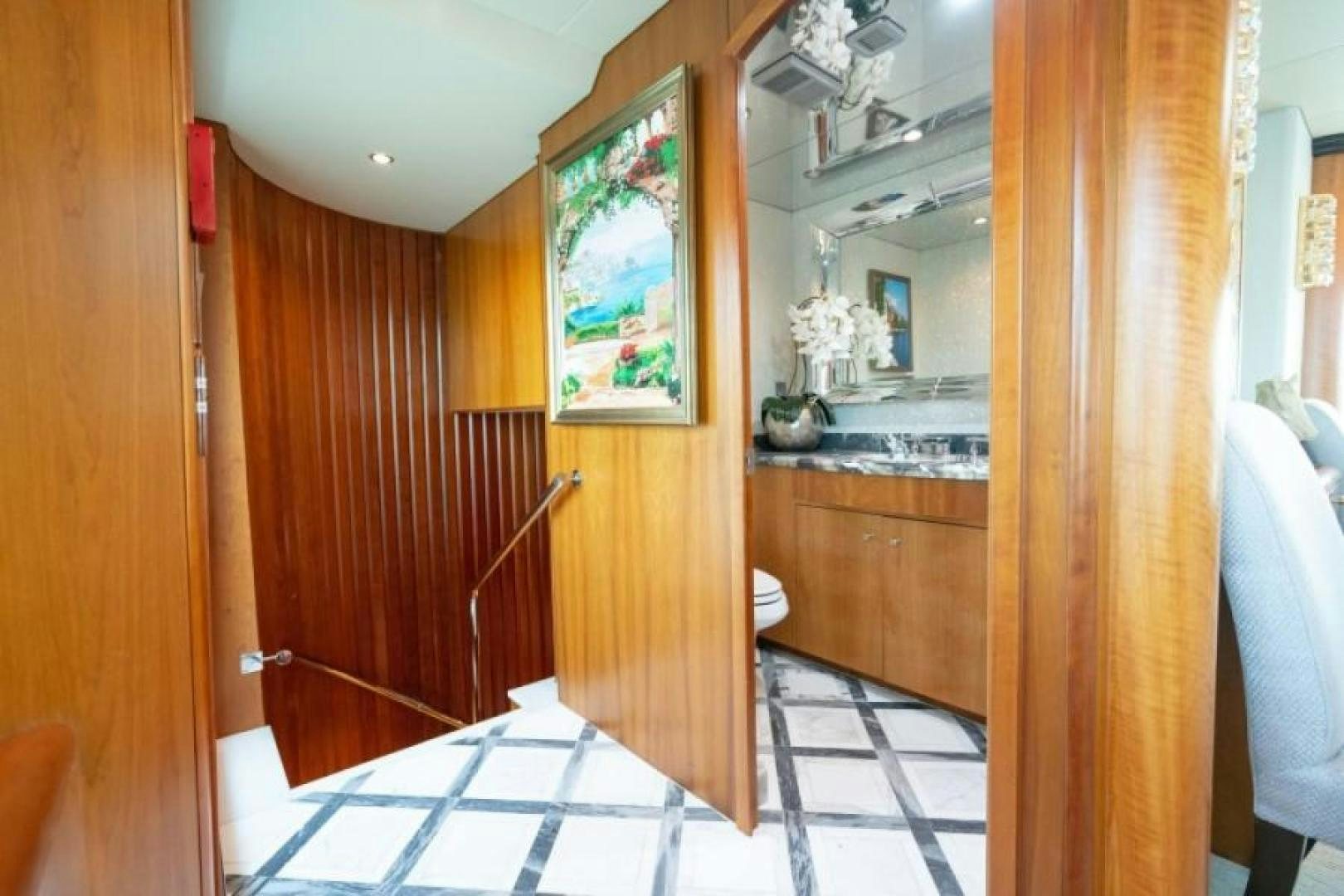 a bathroom with wooden cabinets aboard DANIELLE Yacht for Sale