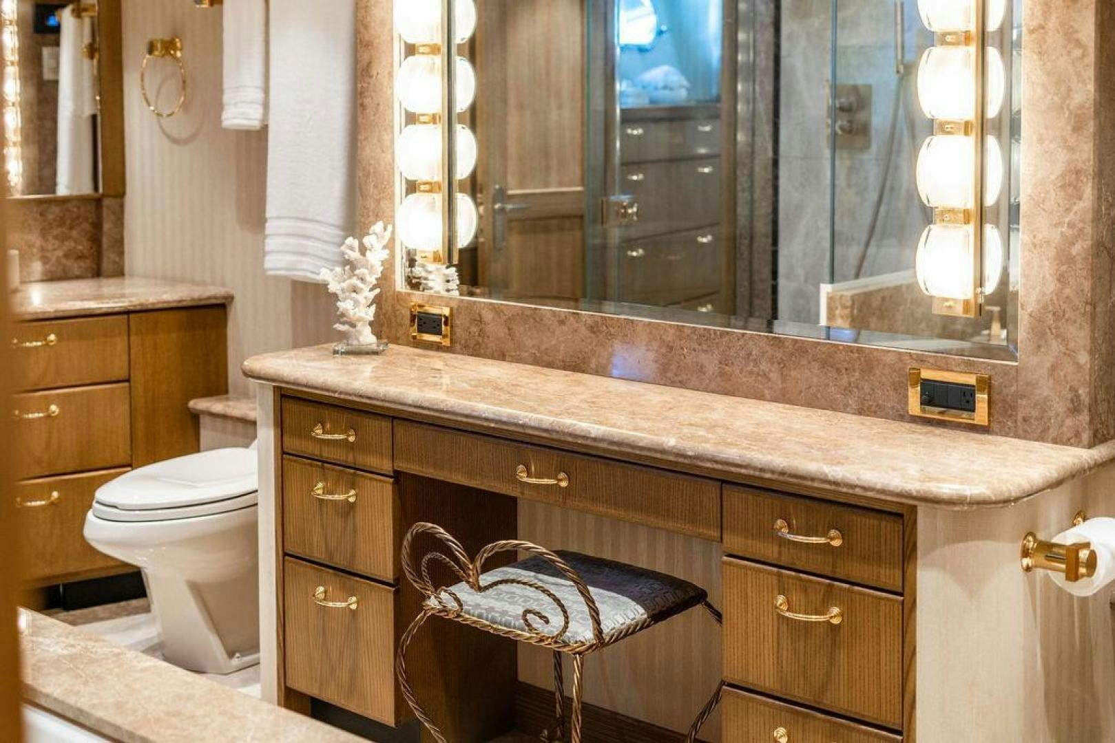 a bathroom with a large mirror aboard NORTH COAST 120 Yacht for Sale
