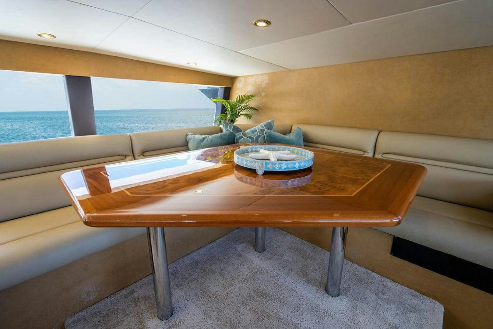 a table with a plate on it aboard NORTH COAST 120 Yacht for Sale
