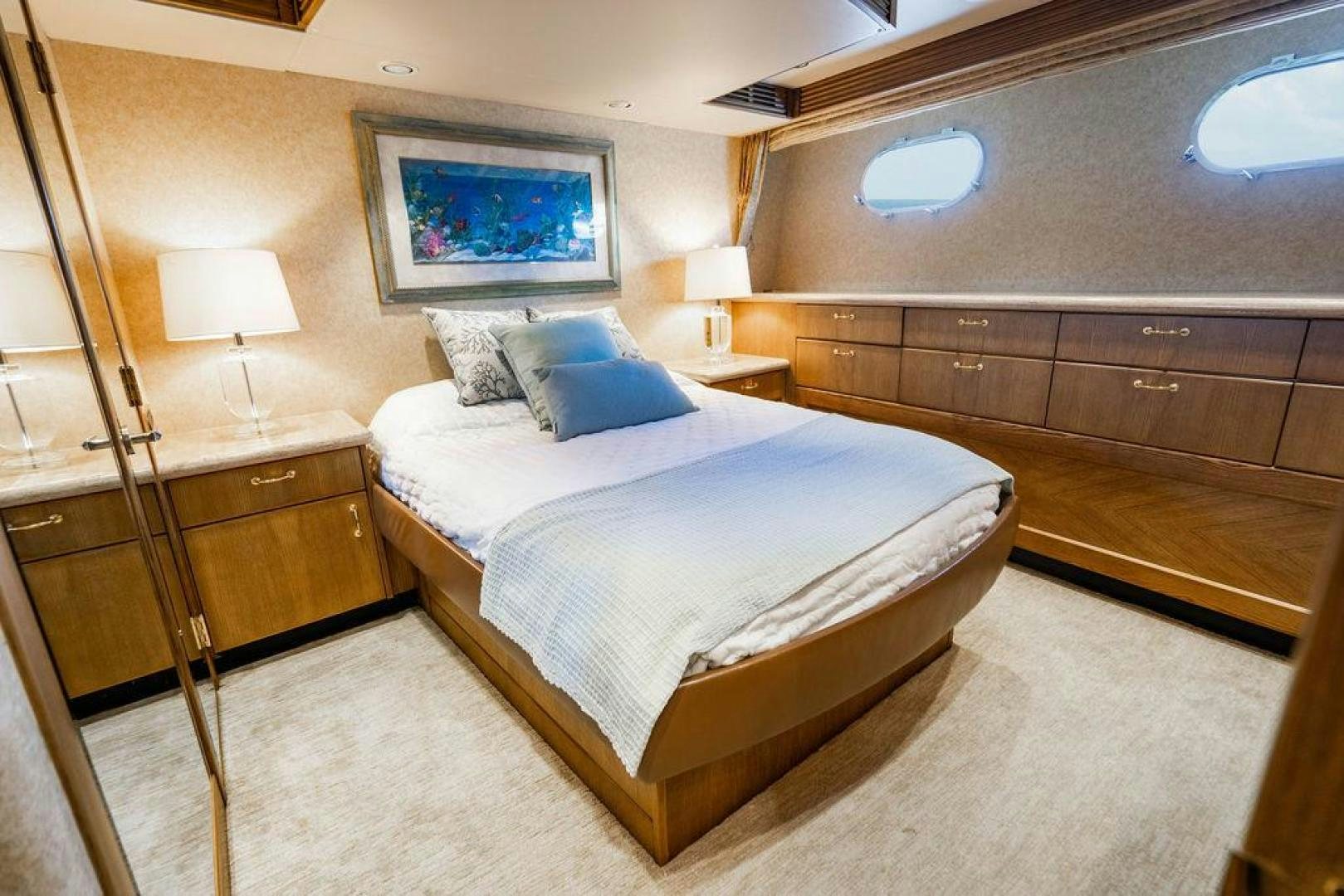 a bedroom with a bed and a desk aboard NORTH COAST 120 Yacht for Sale