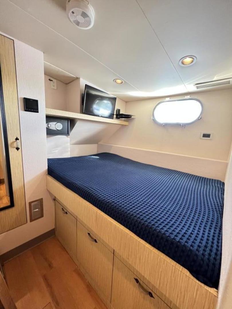 a bed in a room aboard NORTH COAST 120 Yacht for Sale