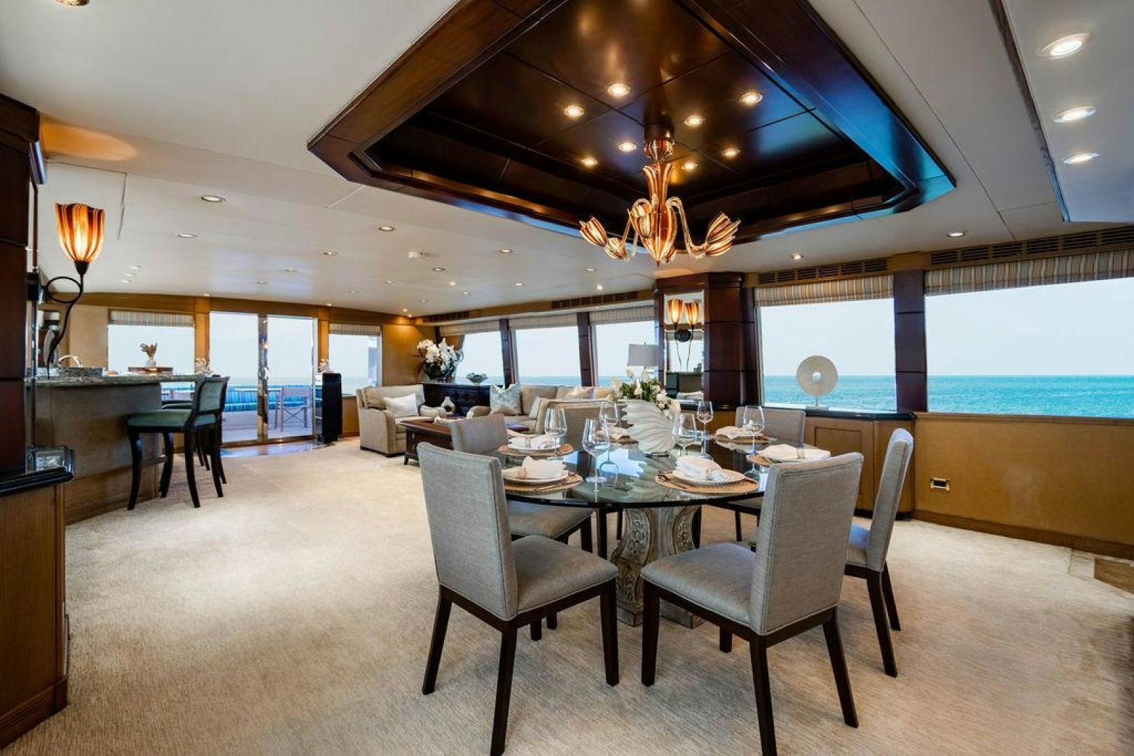 a large dining room with a large open floor plan aboard NORTH COAST 120 Yacht for Sale