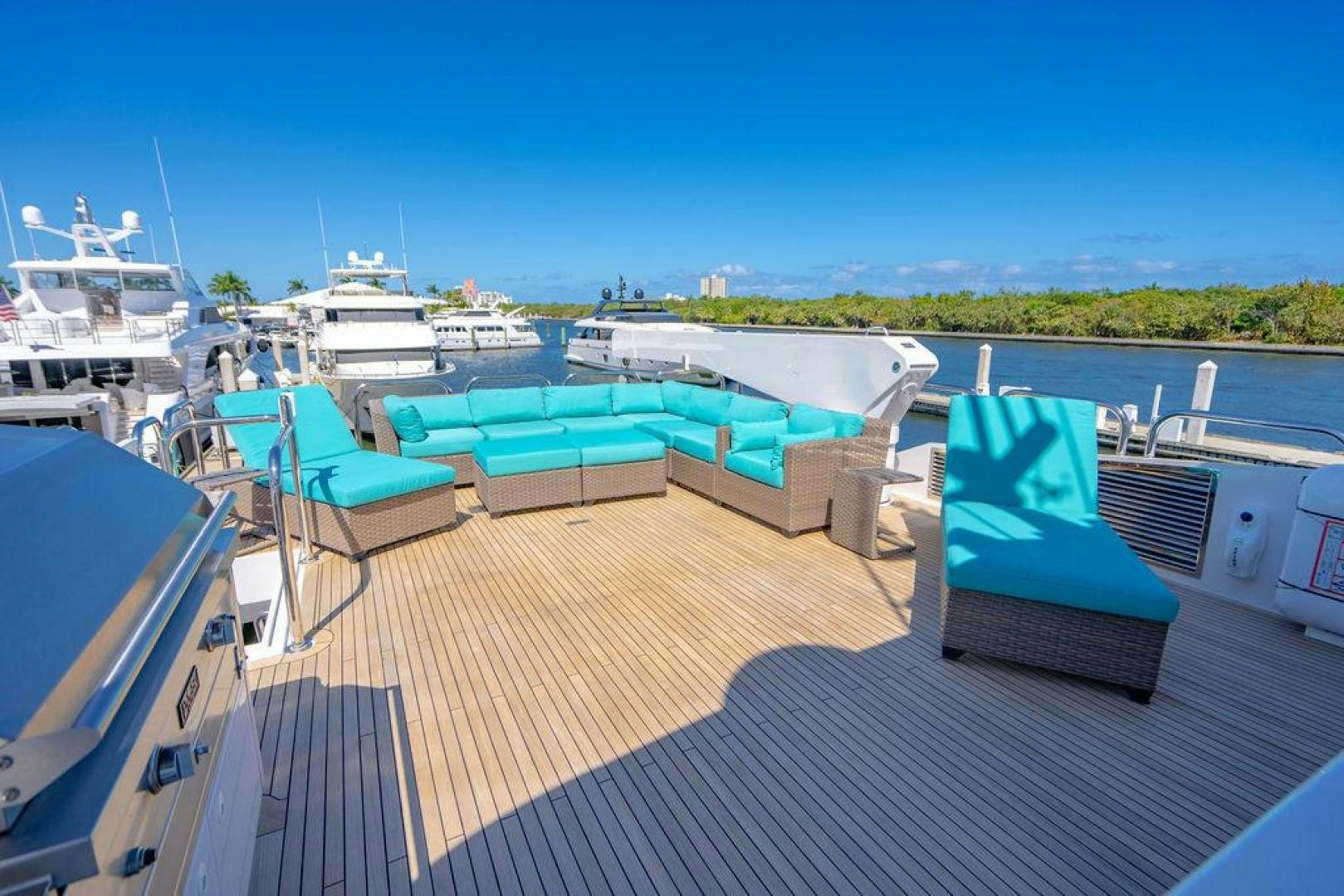 a deck with boats and a blue sky aboard NORTH COAST 120 Yacht for Sale