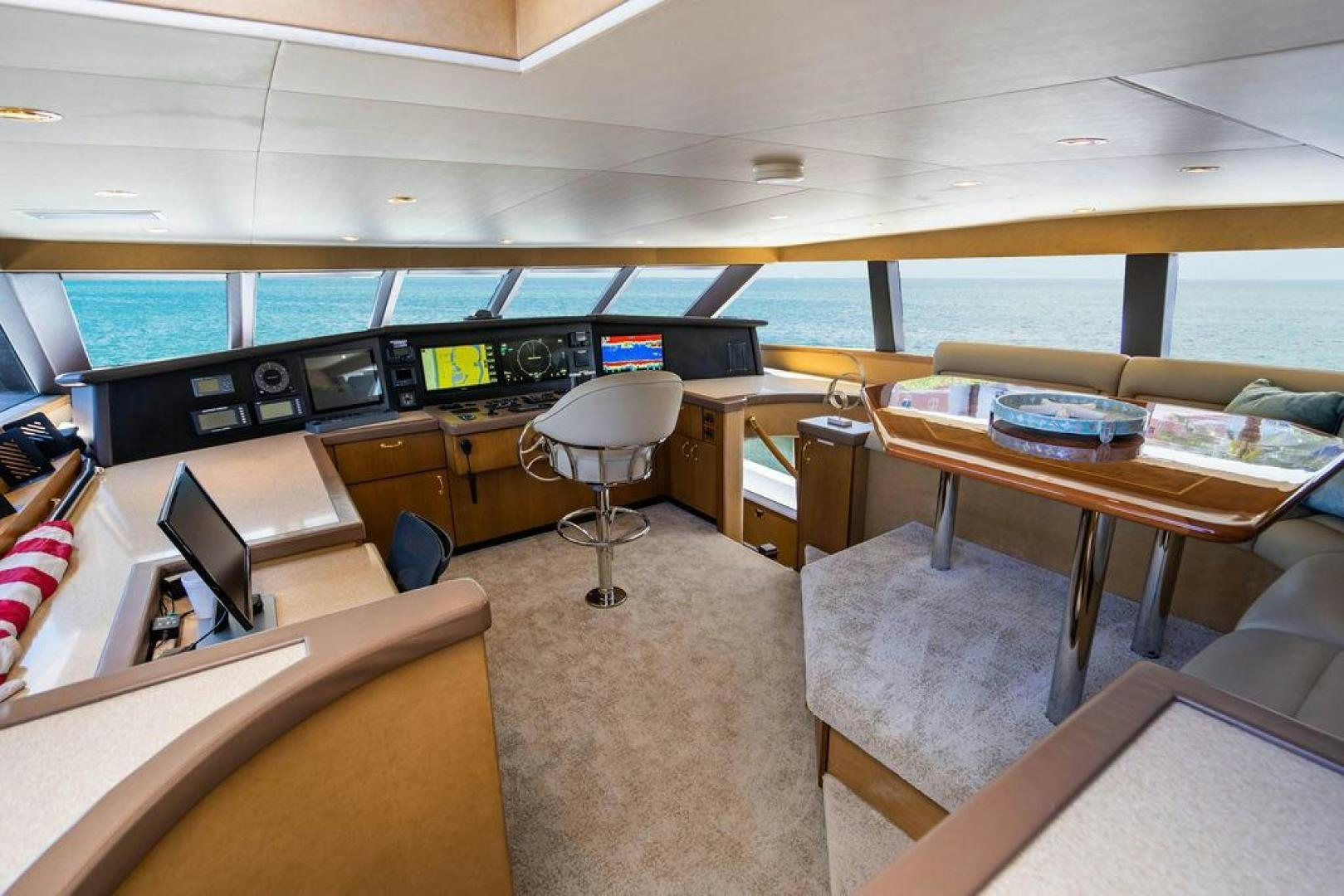 inside of a building with tables and chairs aboard NORTH COAST 120 Yacht for Sale