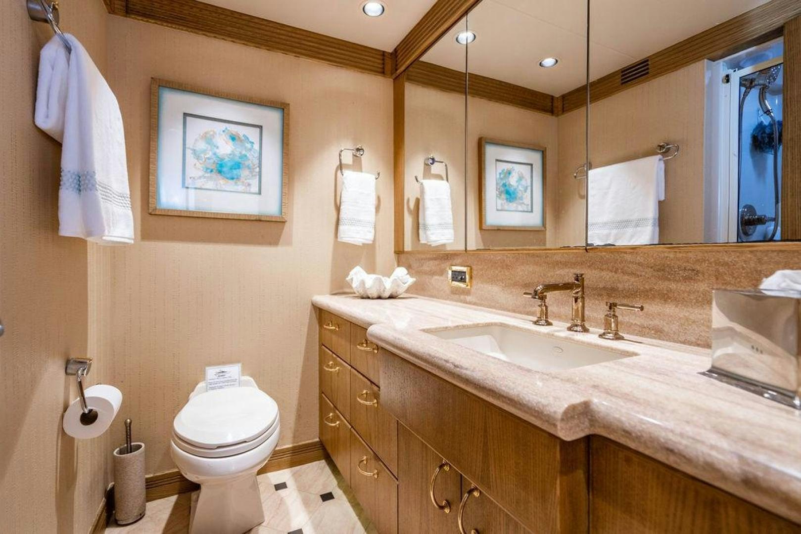a bathroom with a large mirror aboard NORTH COAST 120 Yacht for Sale