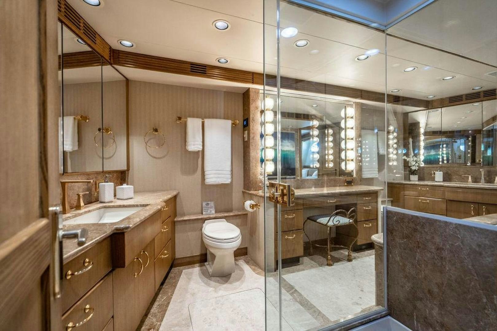 a bathroom with a glass shower aboard NORTH COAST 120 Yacht for Sale