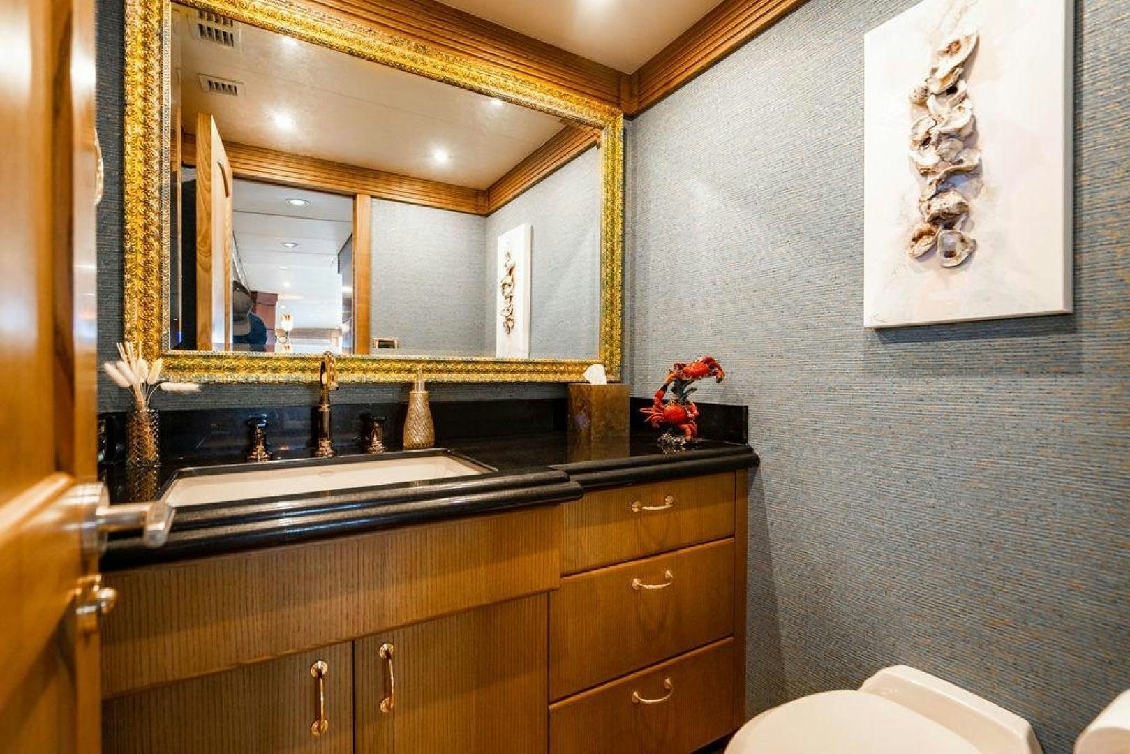 a bathroom with a large mirror aboard NORTH COAST 120 Yacht for Sale