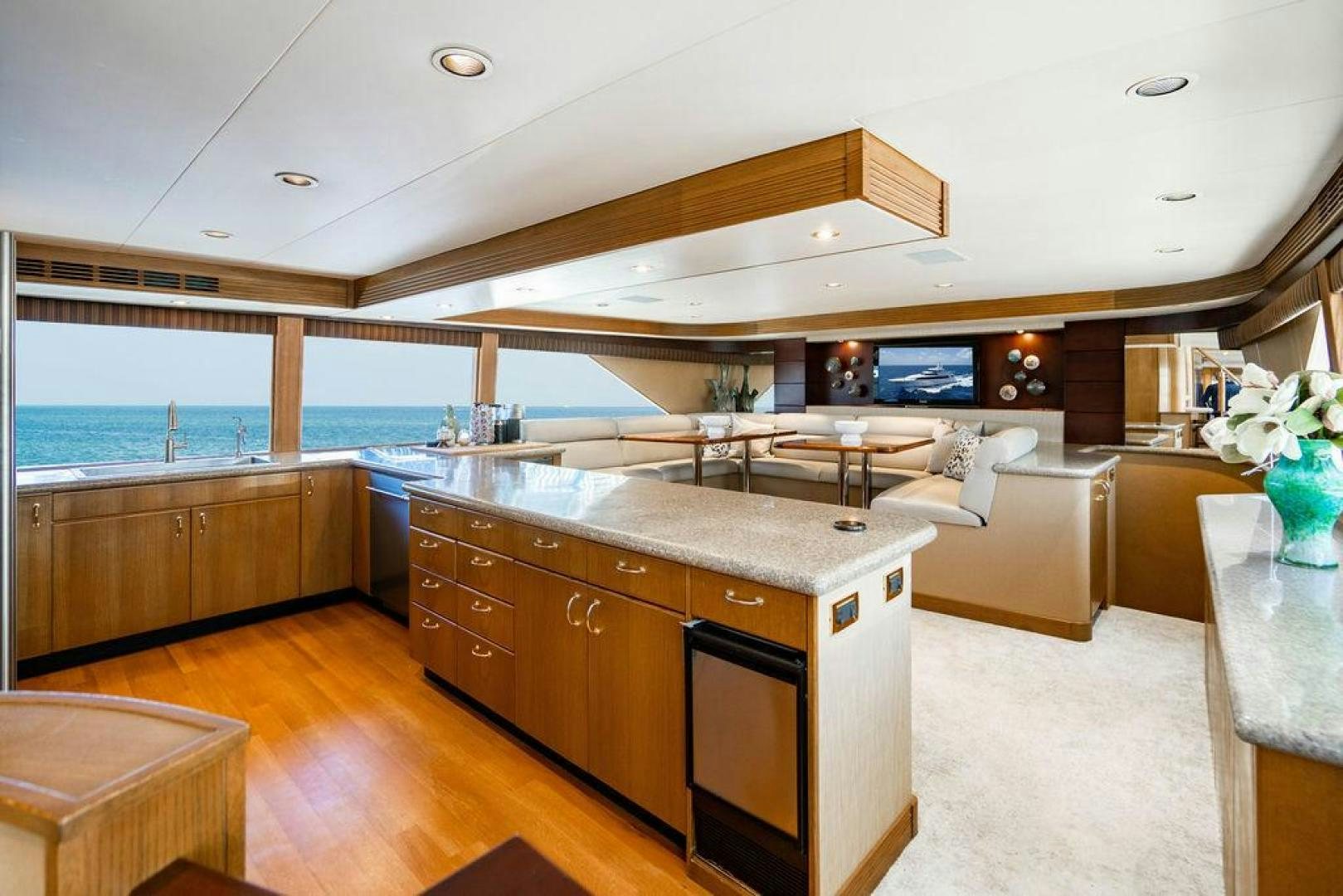 a kitchen with a large island aboard NORTH COAST 120 Yacht for Sale