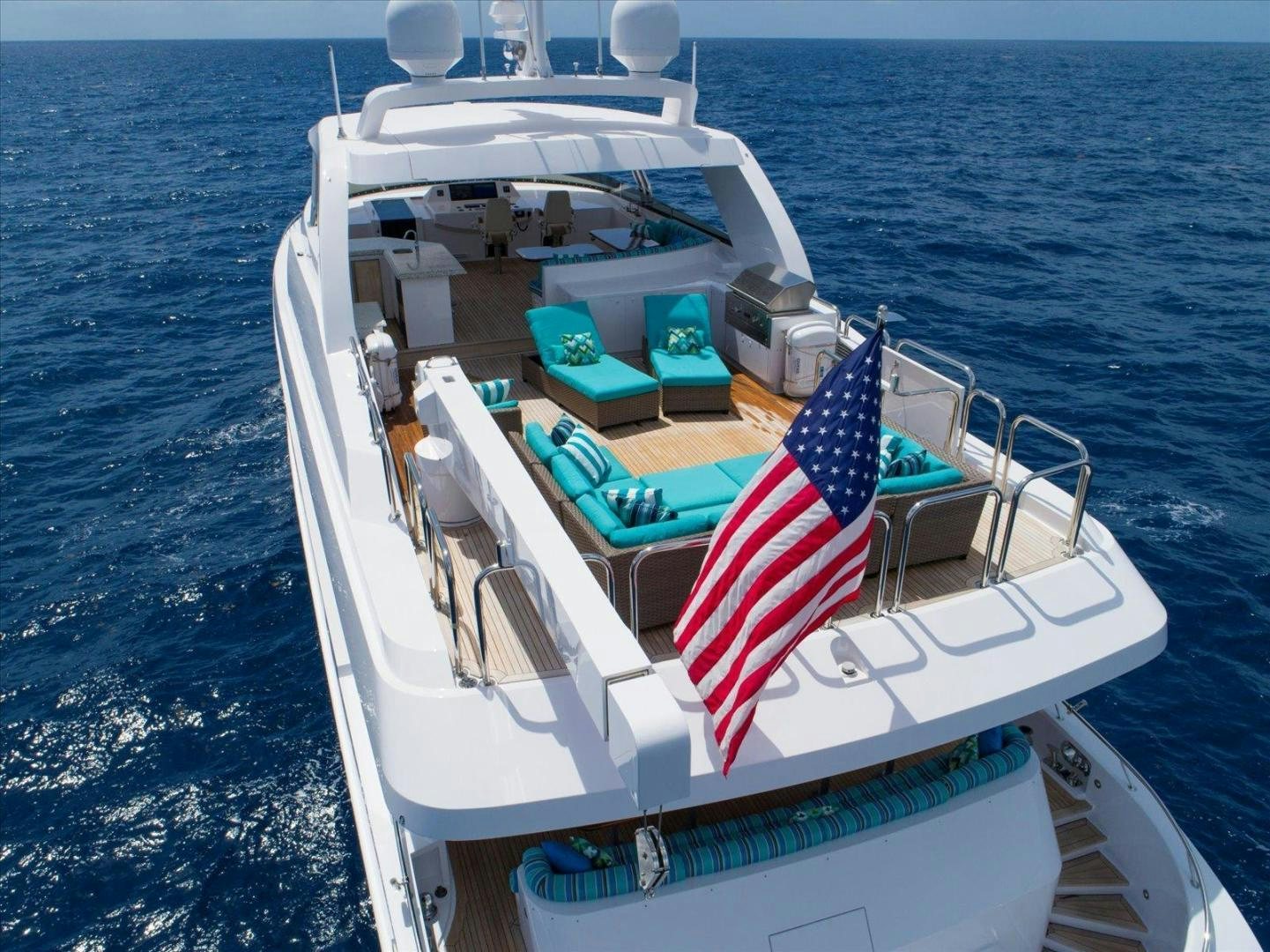a boat with flags on it aboard NORTH COAST 120 Yacht for Sale