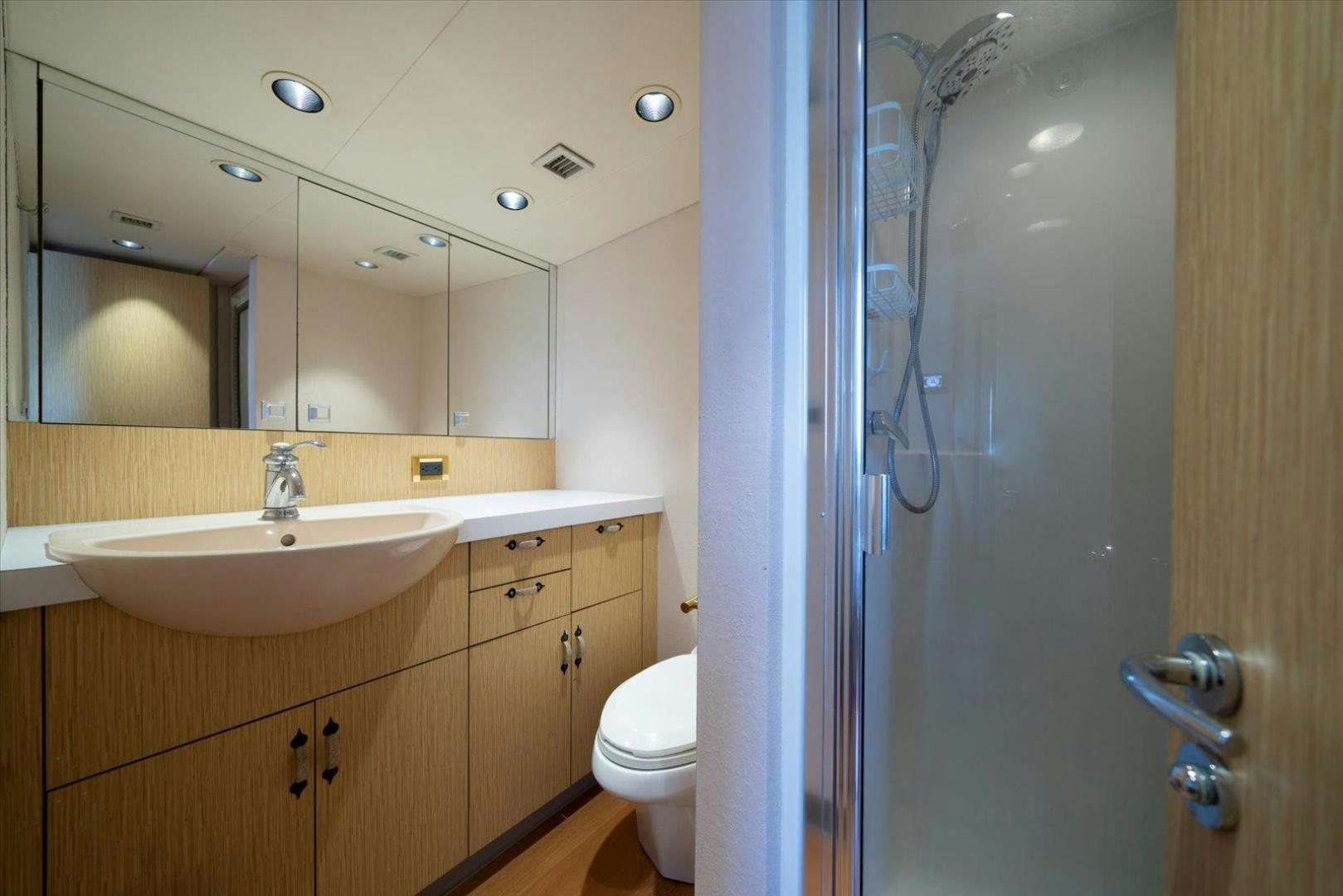 a bathroom with a sink and a toilet aboard NORTH COAST 120 Yacht for Sale