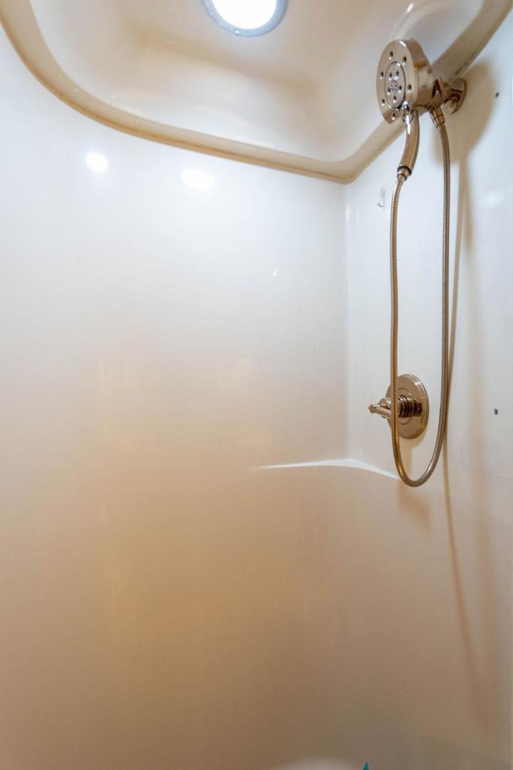 a shower head with a glass door aboard NORTH COAST 120 Yacht for Sale