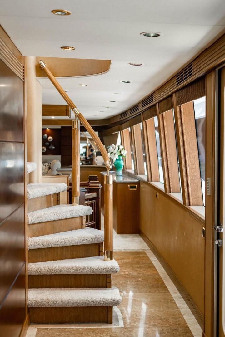 a wood staircase in a room aboard NORTH COAST 120 Yacht for Sale