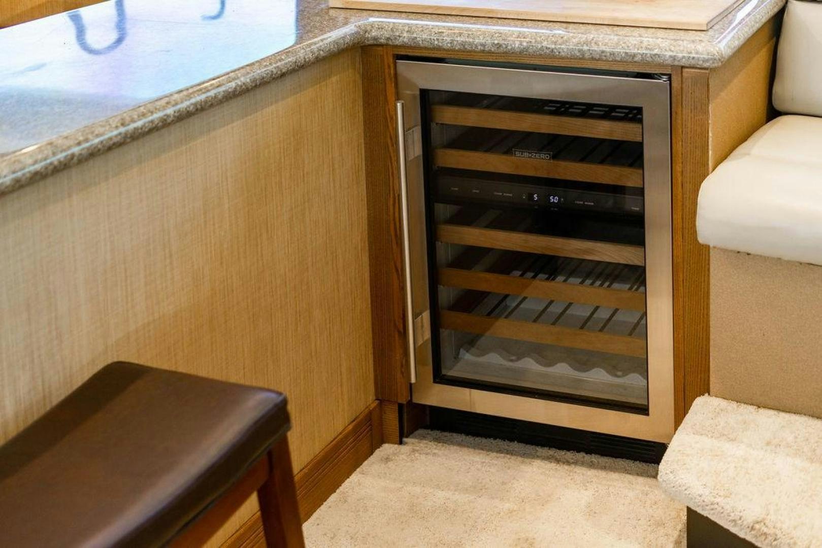 a fireplace with glass doors aboard NORTH COAST 120 Yacht for Sale