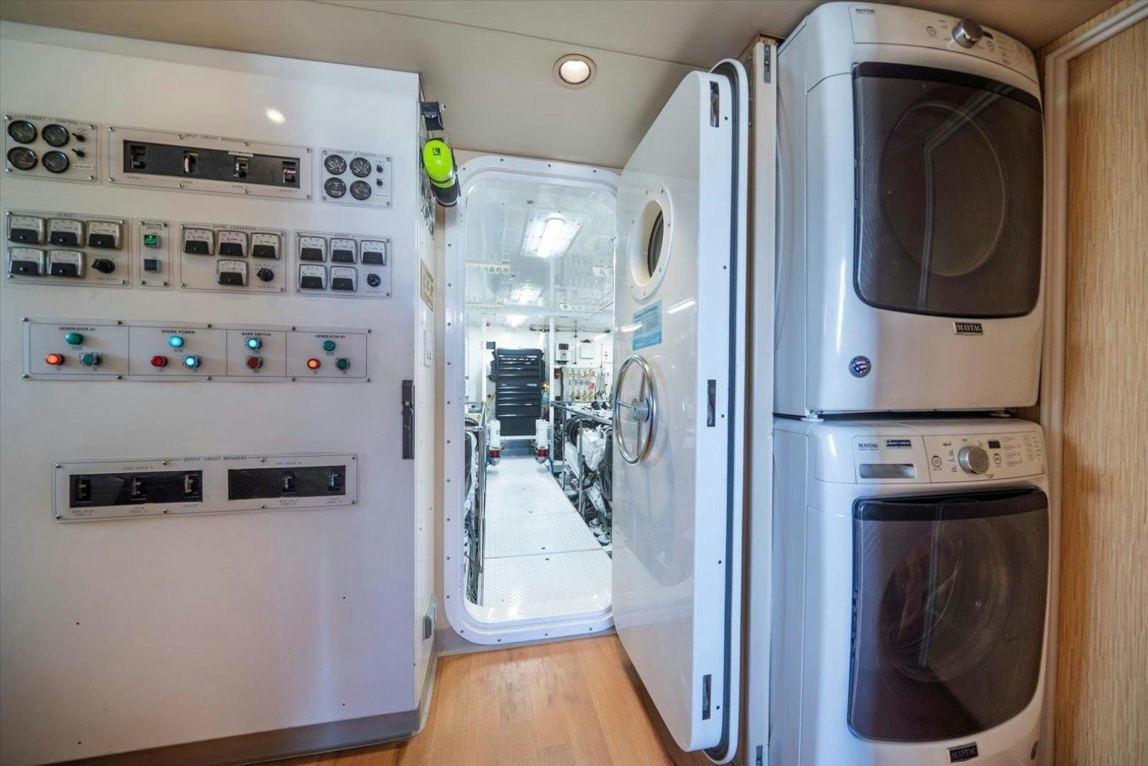 a room with a washer and dryer aboard NORTH COAST 120 Yacht for Sale