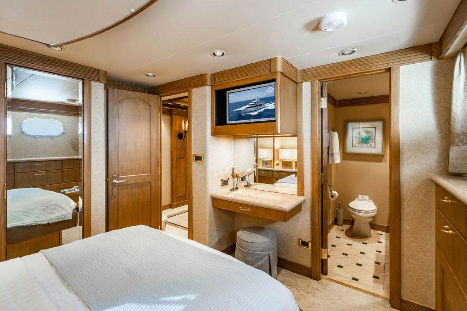 a bathroom with a bed and a television aboard NORTH COAST 120 Yacht for Sale