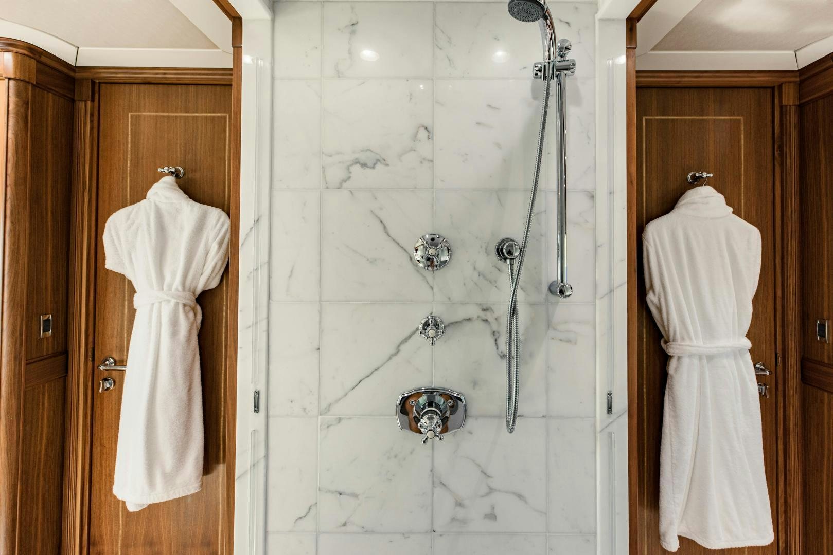 a white robe on a swinger aboard INVICTUS Yacht for Sale