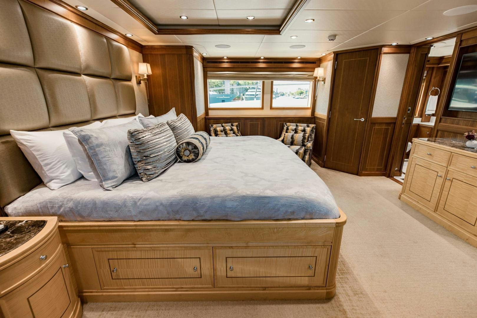 a large bedroom with a bed aboard INVICTUS Yacht for Sale