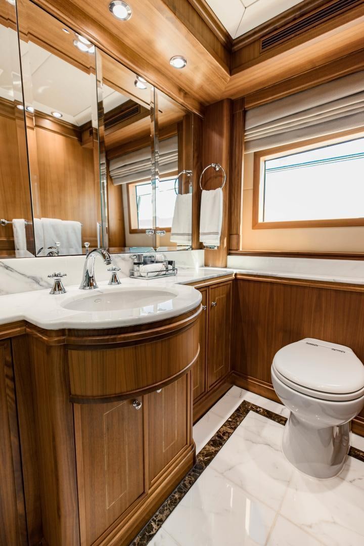 a bathroom with a sink and a toilet aboard INVICTUS Yacht for Sale