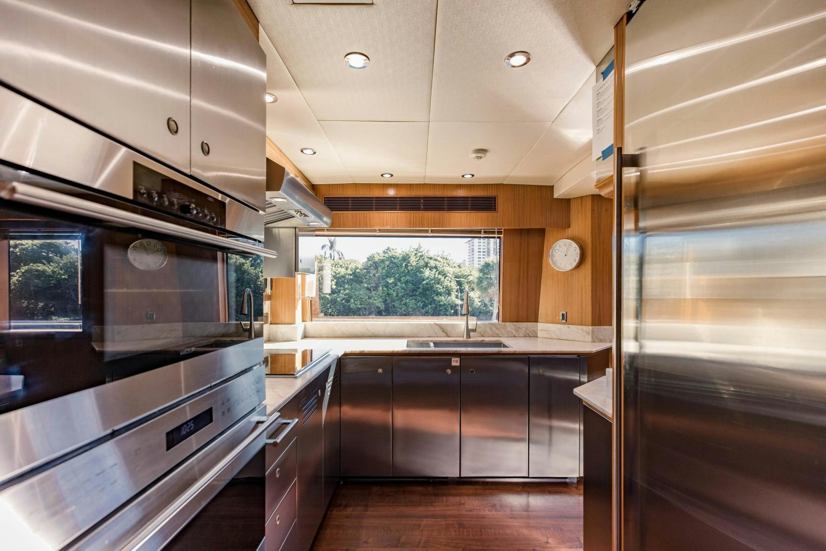 a kitchen with a stove and cabinets aboard INVICTUS Yacht for Sale