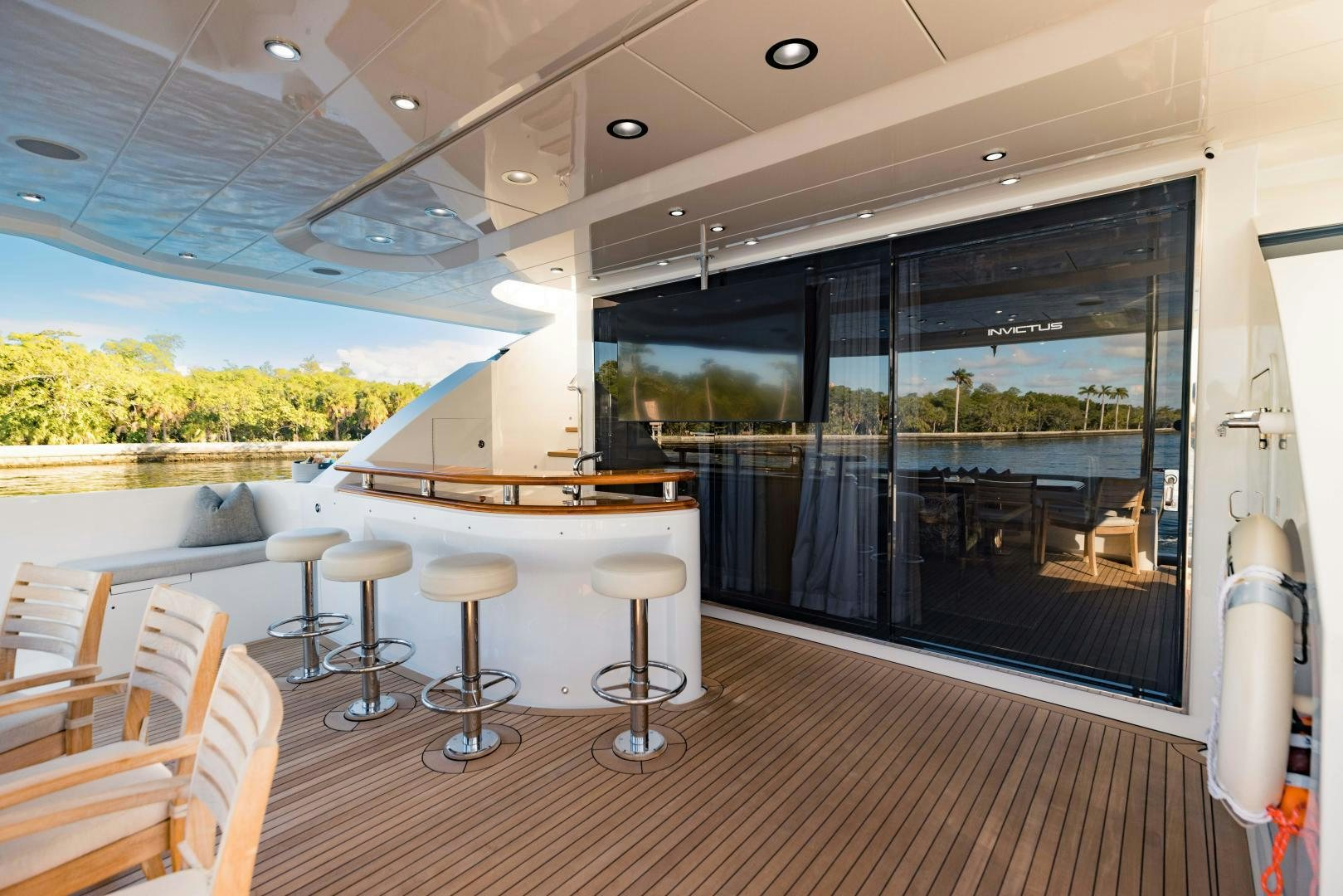 a large room with a pool table and chairs aboard INVICTUS Yacht for Sale