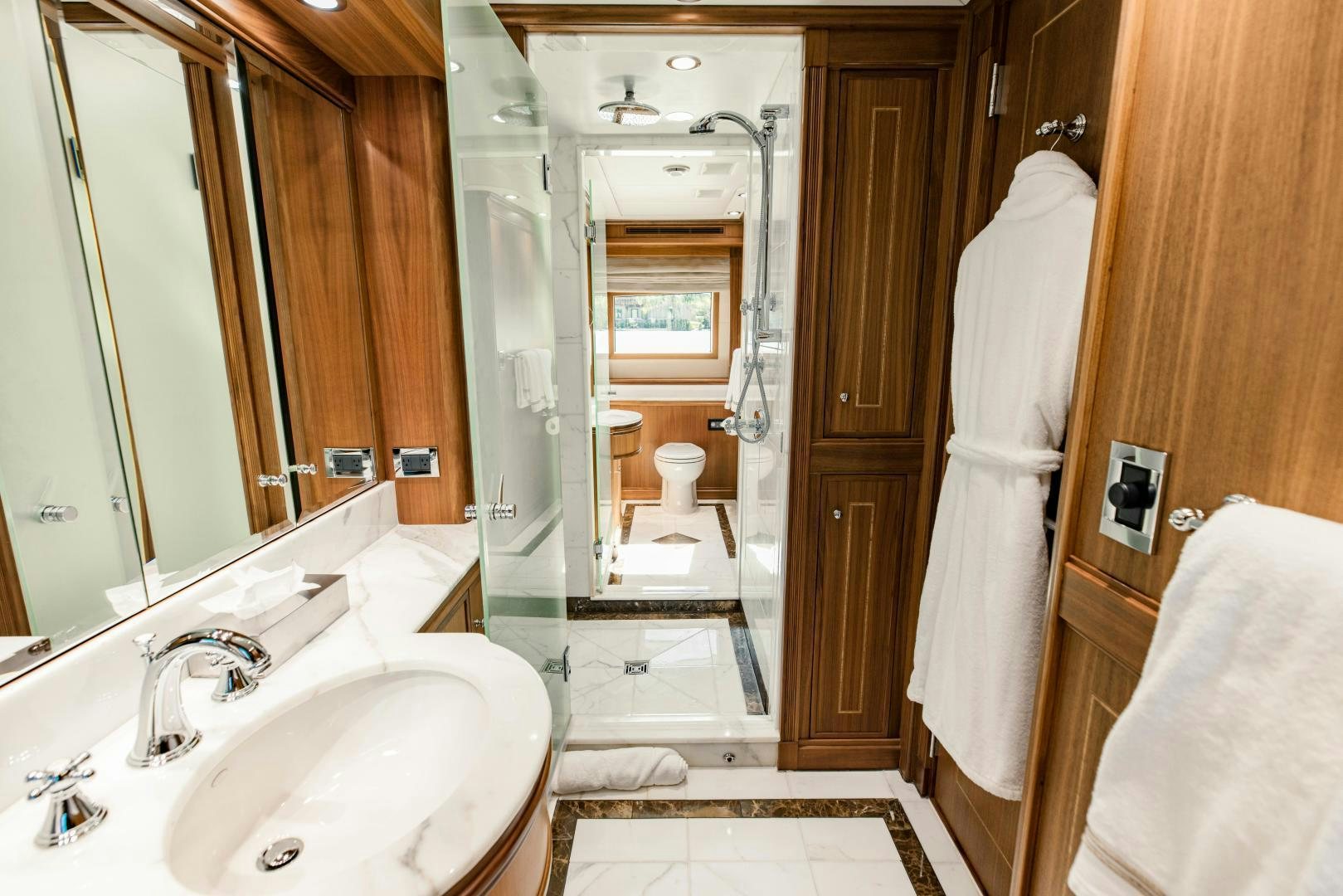 a bathroom with a sink and a shower aboard INVICTUS Yacht for Sale