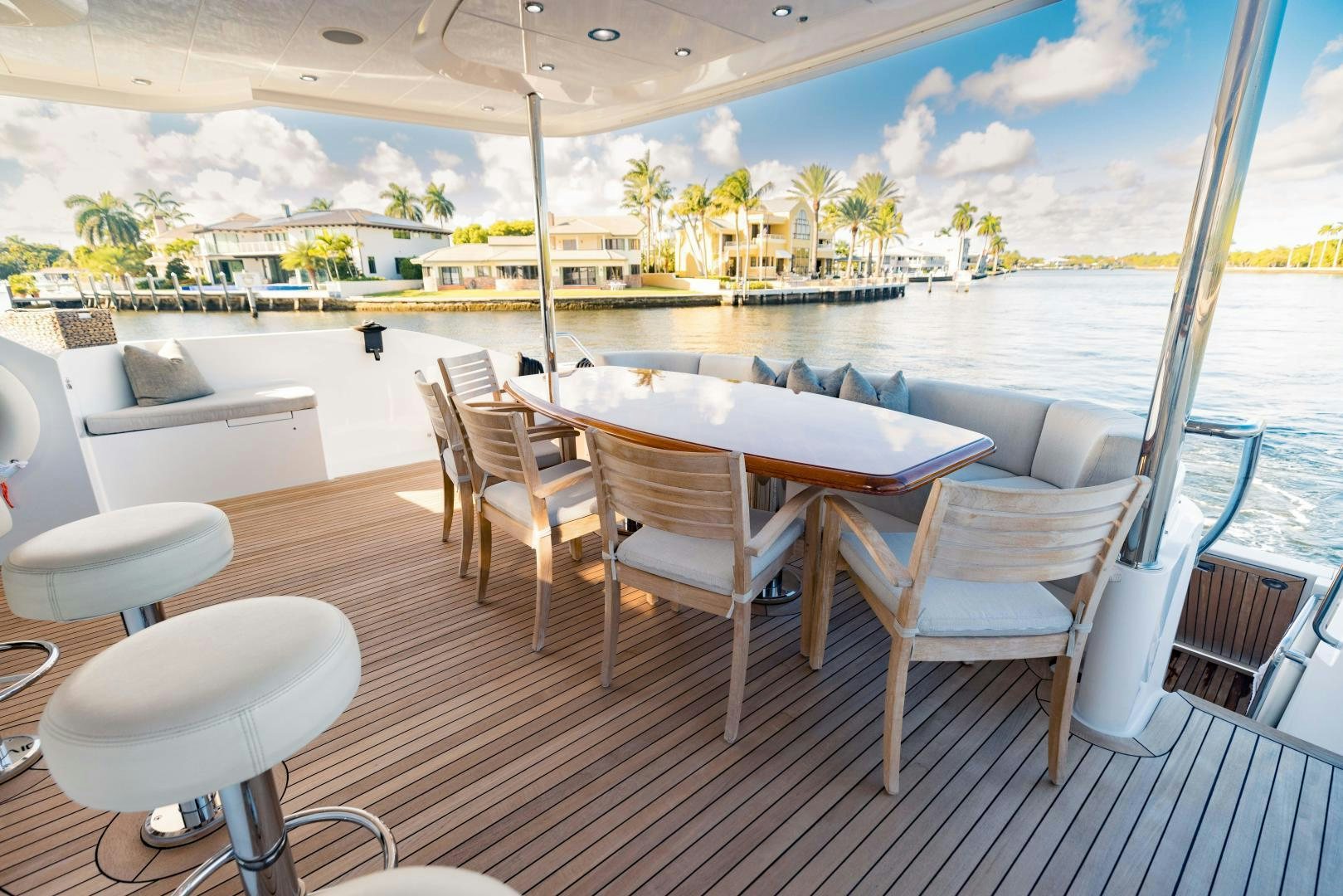 a table and chairs on a deck aboard INVICTUS Yacht for Sale