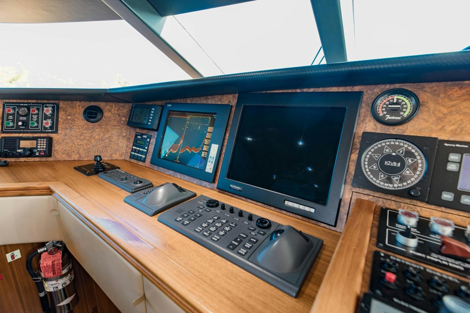 a desk with a computer and a keyboard aboard INVICTUS Yacht for Sale