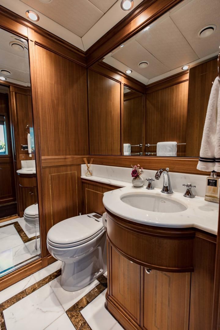 a bathroom with a sink and toilet aboard INVICTUS Yacht for Sale