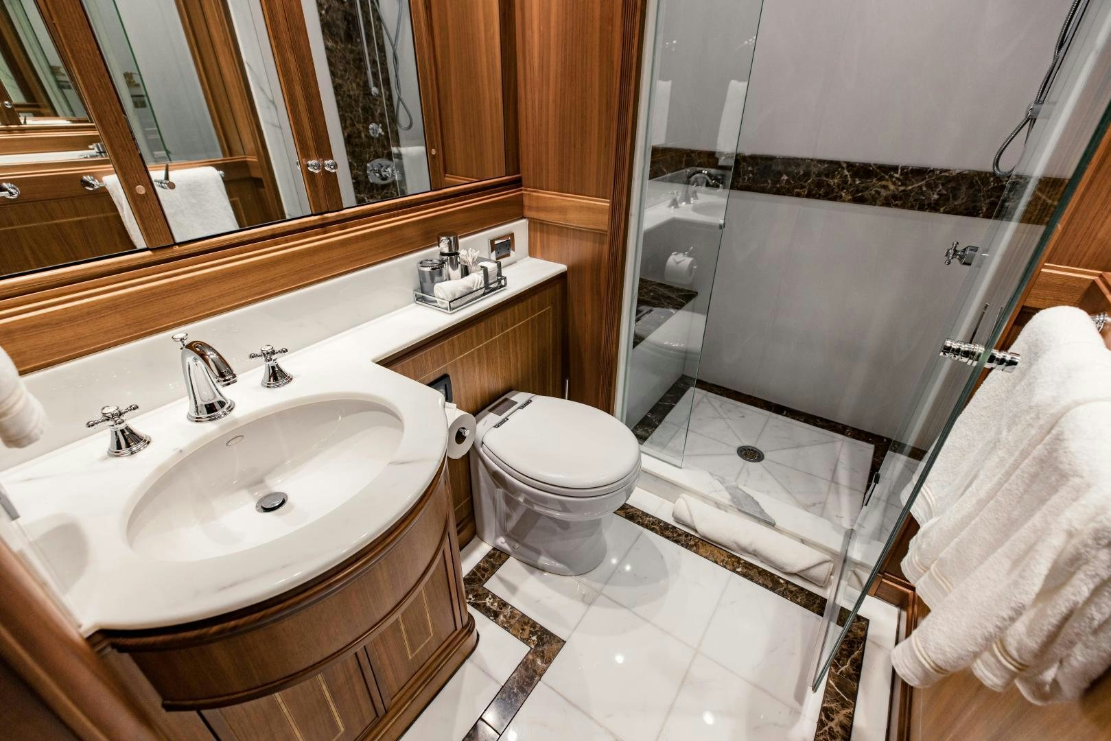 a bathroom with a sink toilet and a bathtub aboard INVICTUS Yacht for Sale