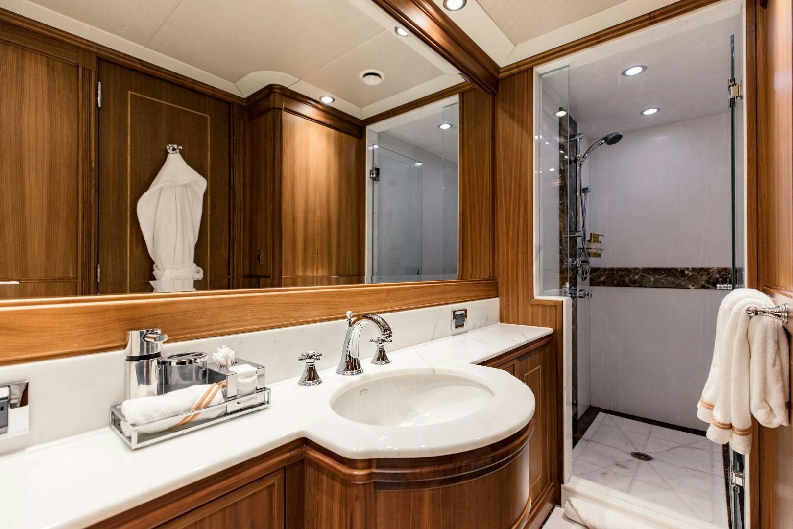 a bathroom with a large mirror aboard INVICTUS Yacht for Sale