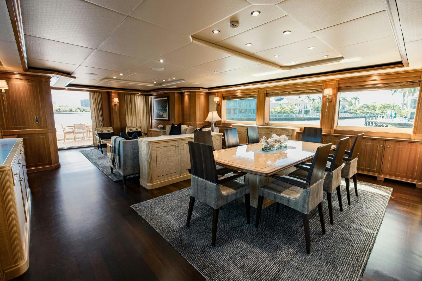 a large dining room with a large table and chairs aboard INVICTUS Yacht for Sale