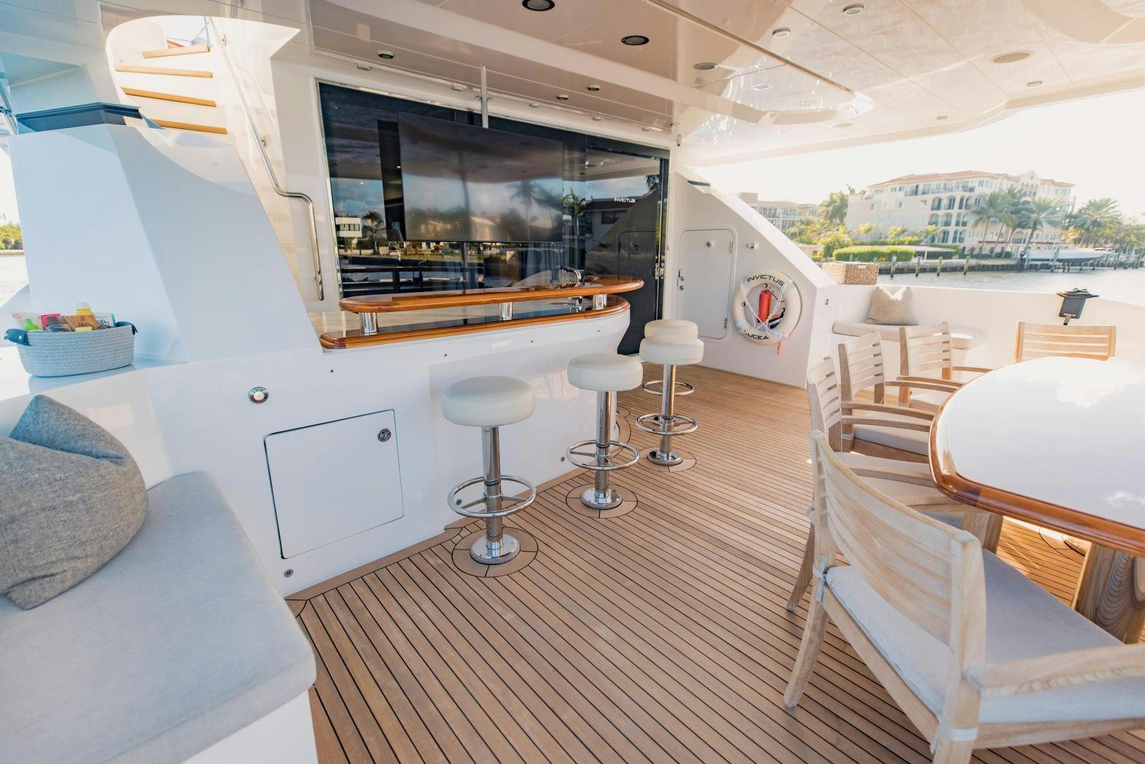 a room with a table chairs and a bed aboard INVICTUS Yacht for Sale