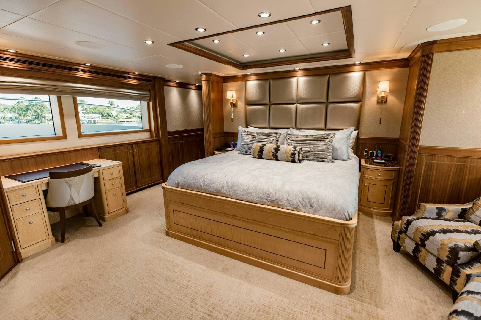 a large bedroom with a large bed aboard INVICTUS Yacht for Sale