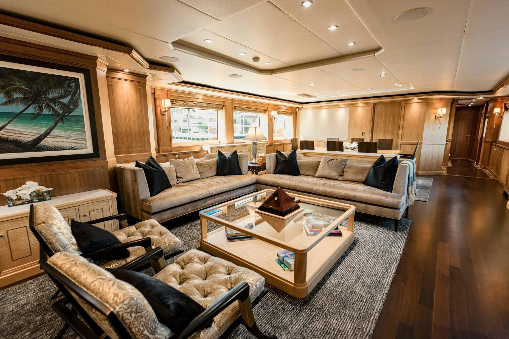 a living room with a couch and a coffee table aboard INVICTUS Yacht for Sale