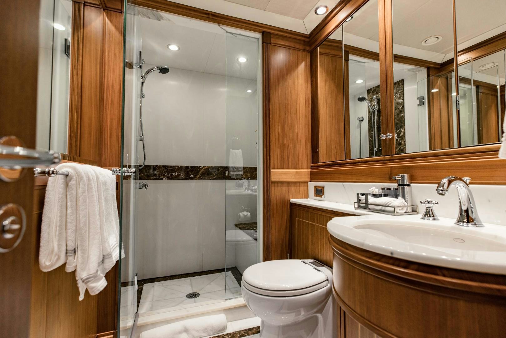 a bathroom with a glass shower aboard INVICTUS Yacht for Sale