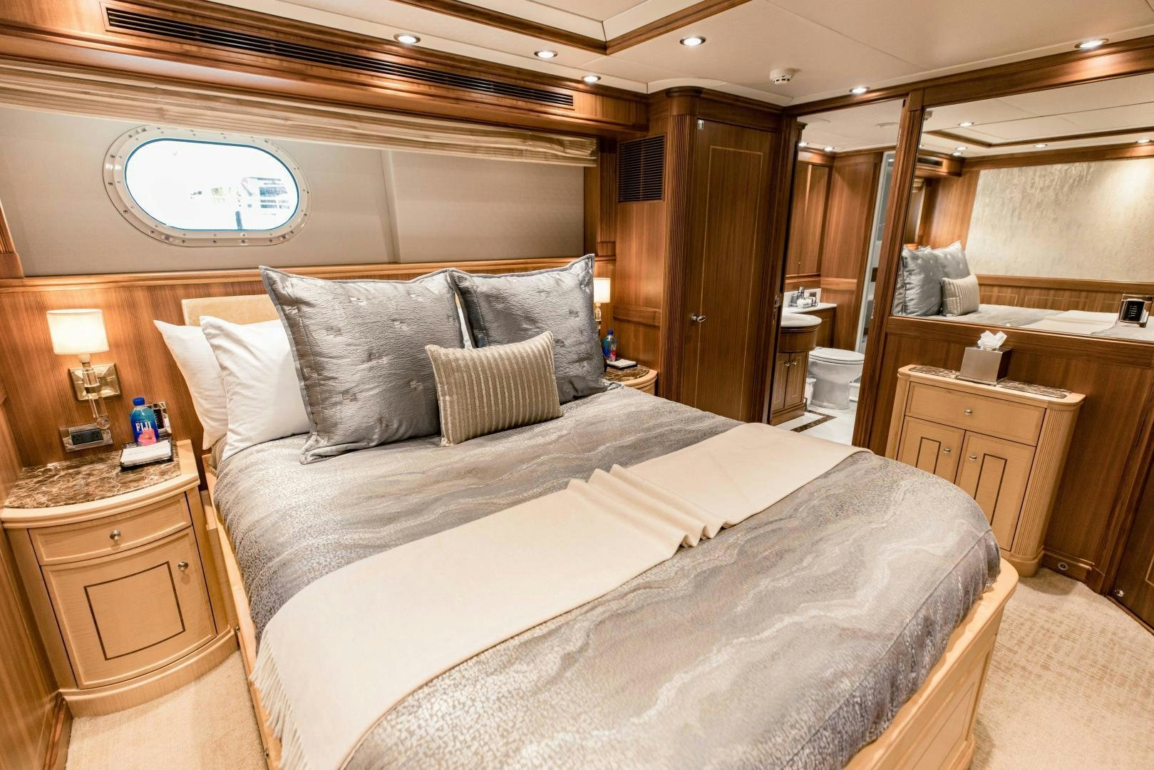 a bed with pillows aboard INVICTUS Yacht for Sale