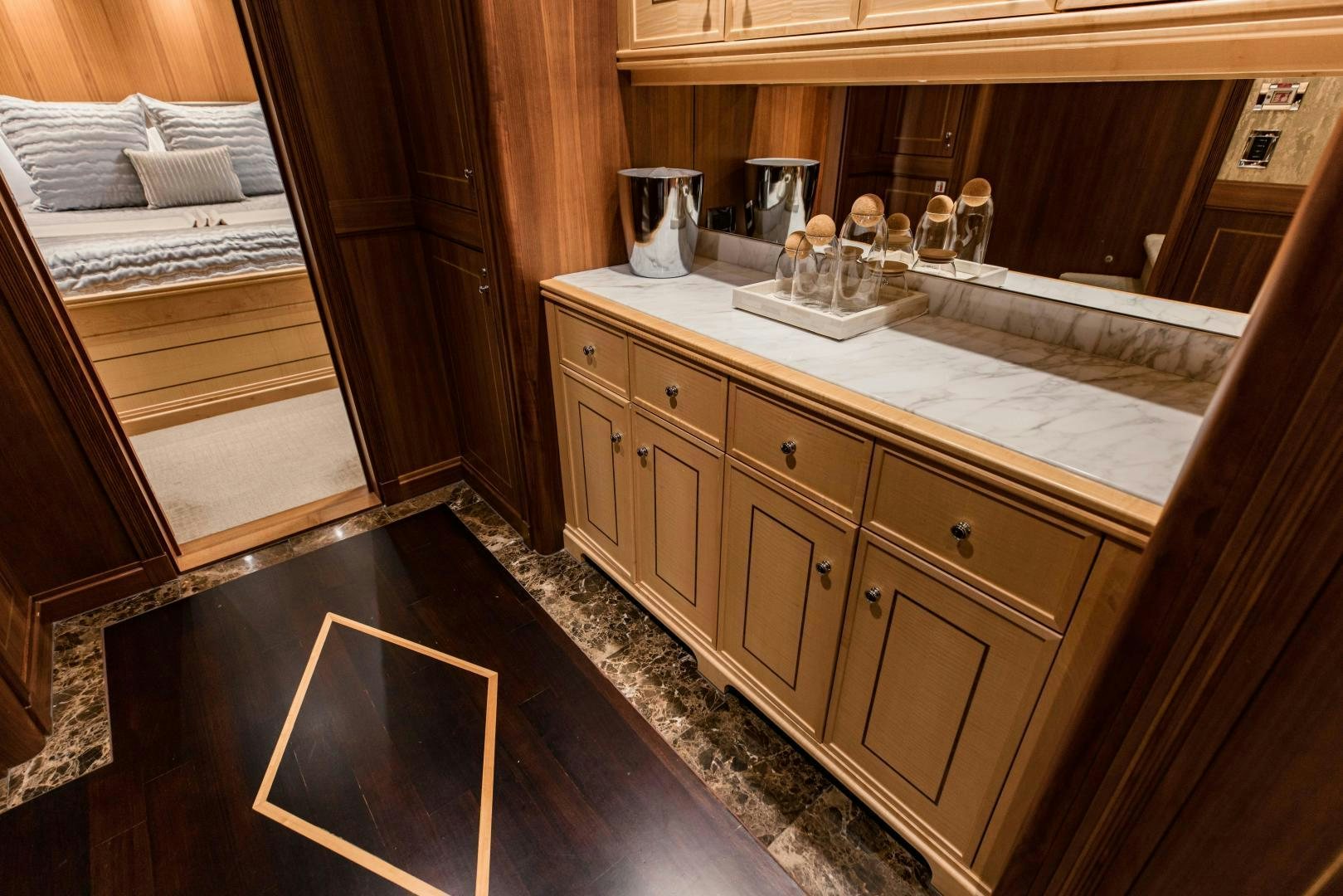 a kitchen with a sink and a bed aboard INVICTUS Yacht for Sale