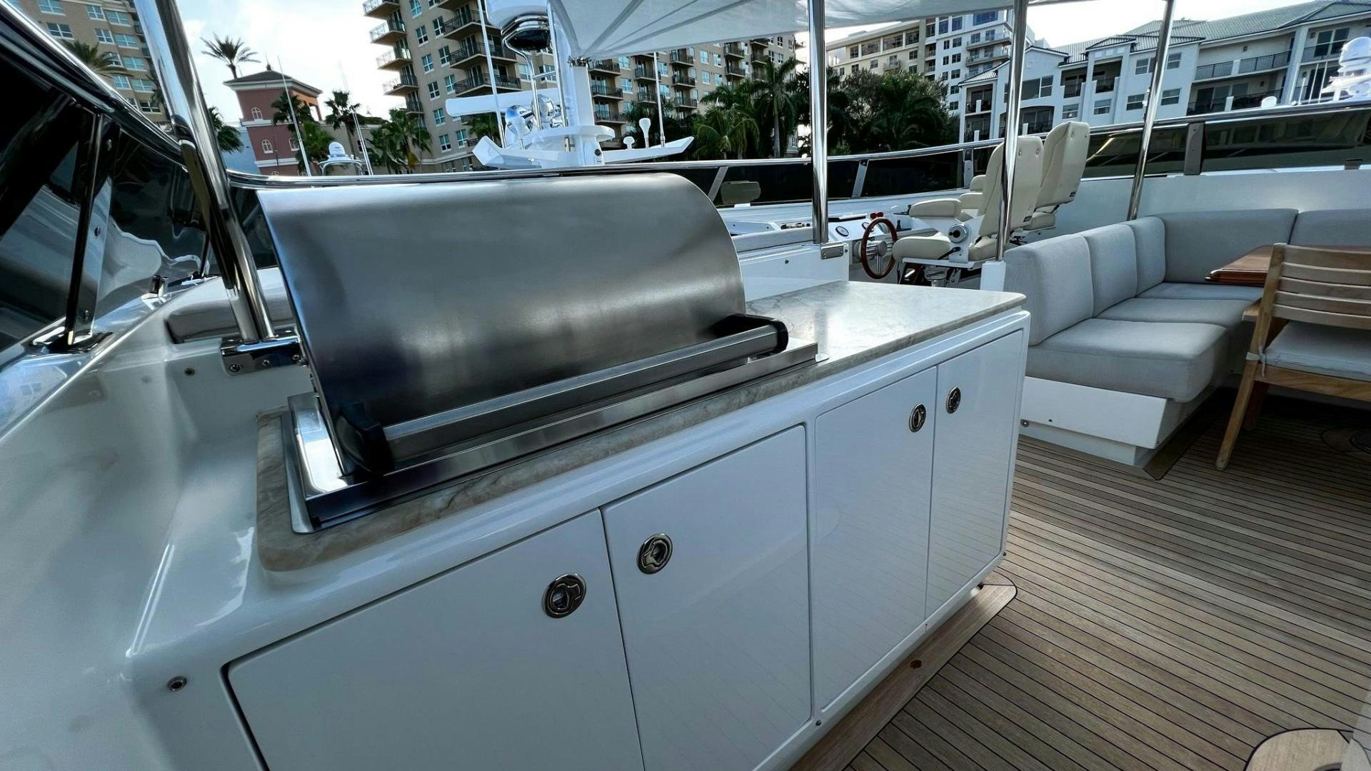 a white car with a grill aboard INVICTUS Yacht for Sale