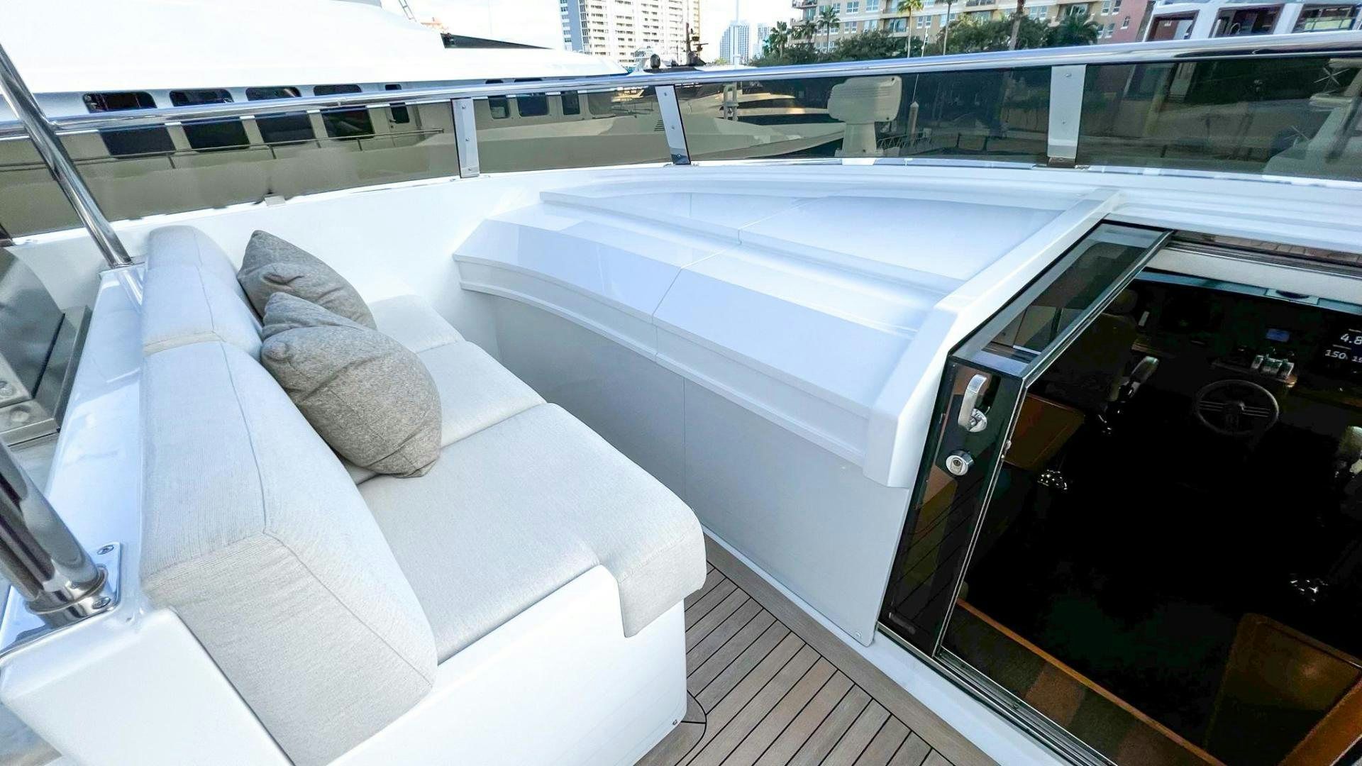 a white couch in a room aboard INVICTUS Yacht for Sale