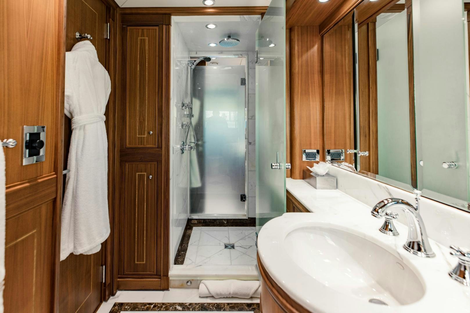 a bathroom with a sink and a mirror aboard INVICTUS Yacht for Sale