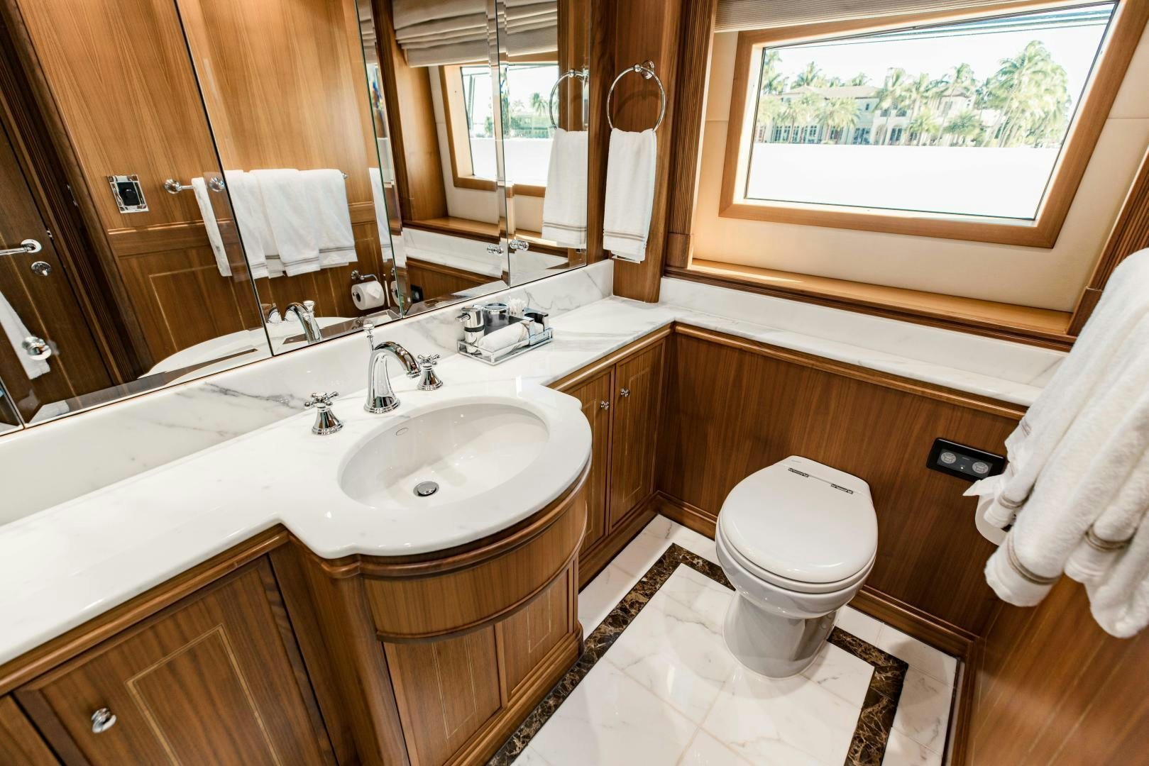 a bathroom with a sink and a toilet aboard INVICTUS Yacht for Sale