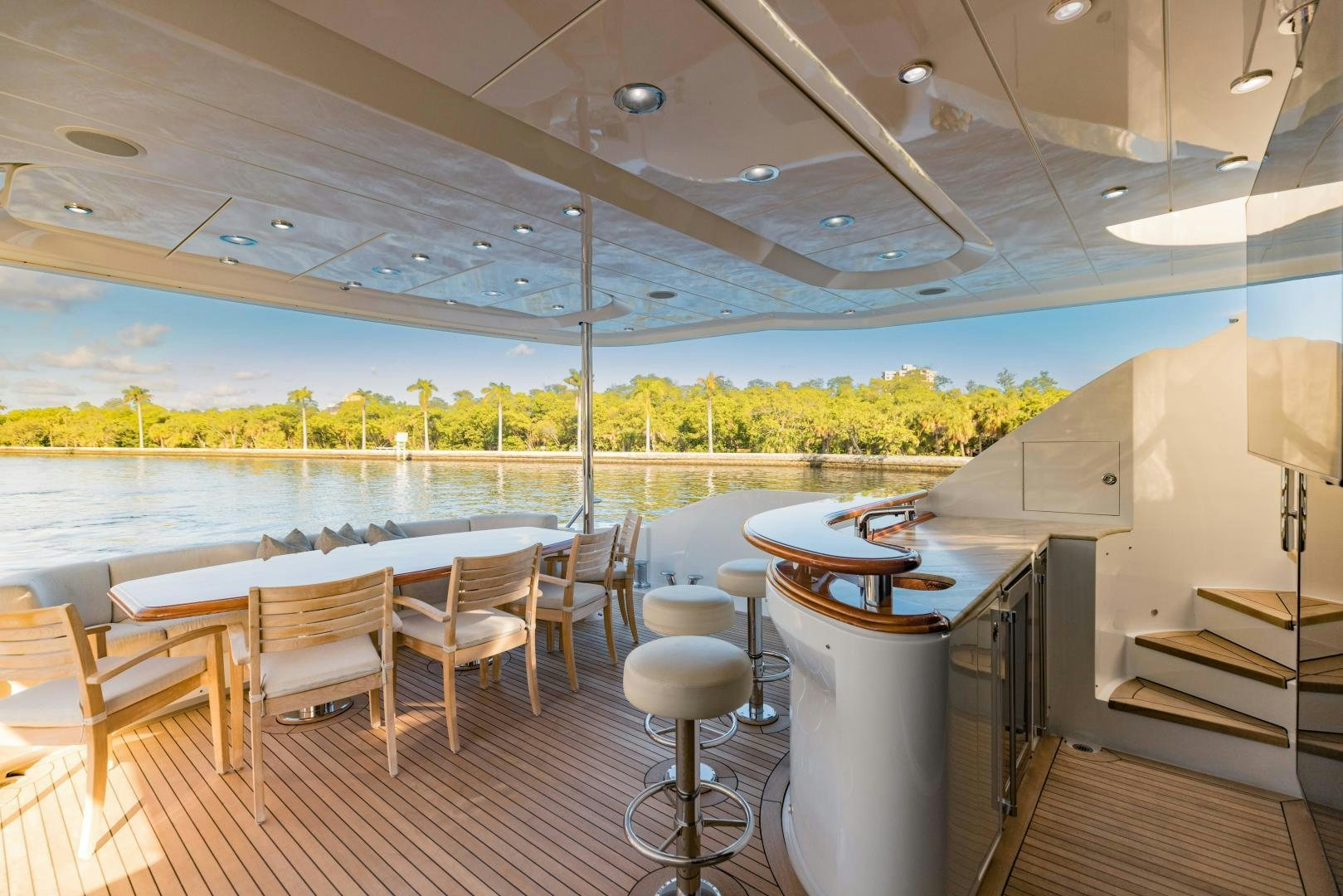 a room with a table and chairs aboard INVICTUS Yacht for Sale
