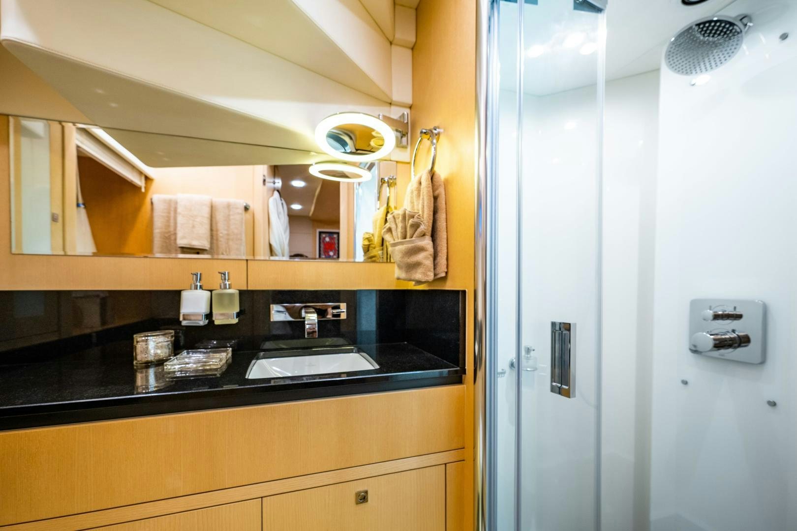 a bathroom with a sink and a mirror aboard THE KING Yacht for Sale