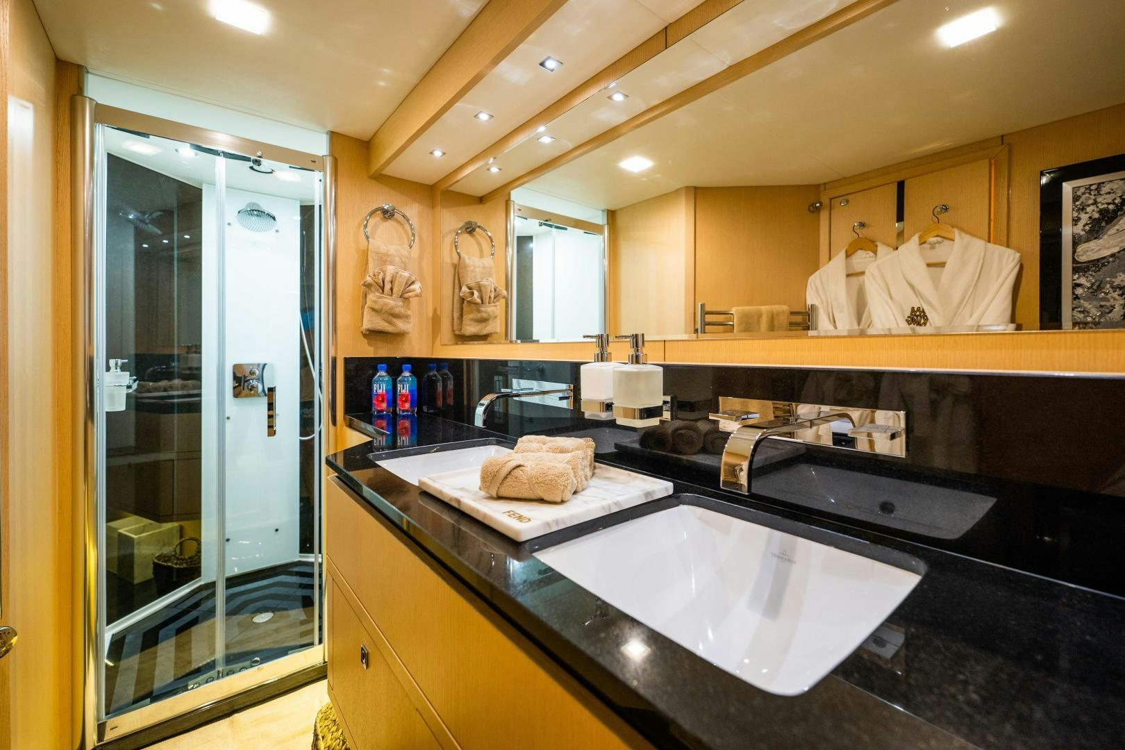 a bathroom with a large glass shower aboard THE KING Yacht for Sale