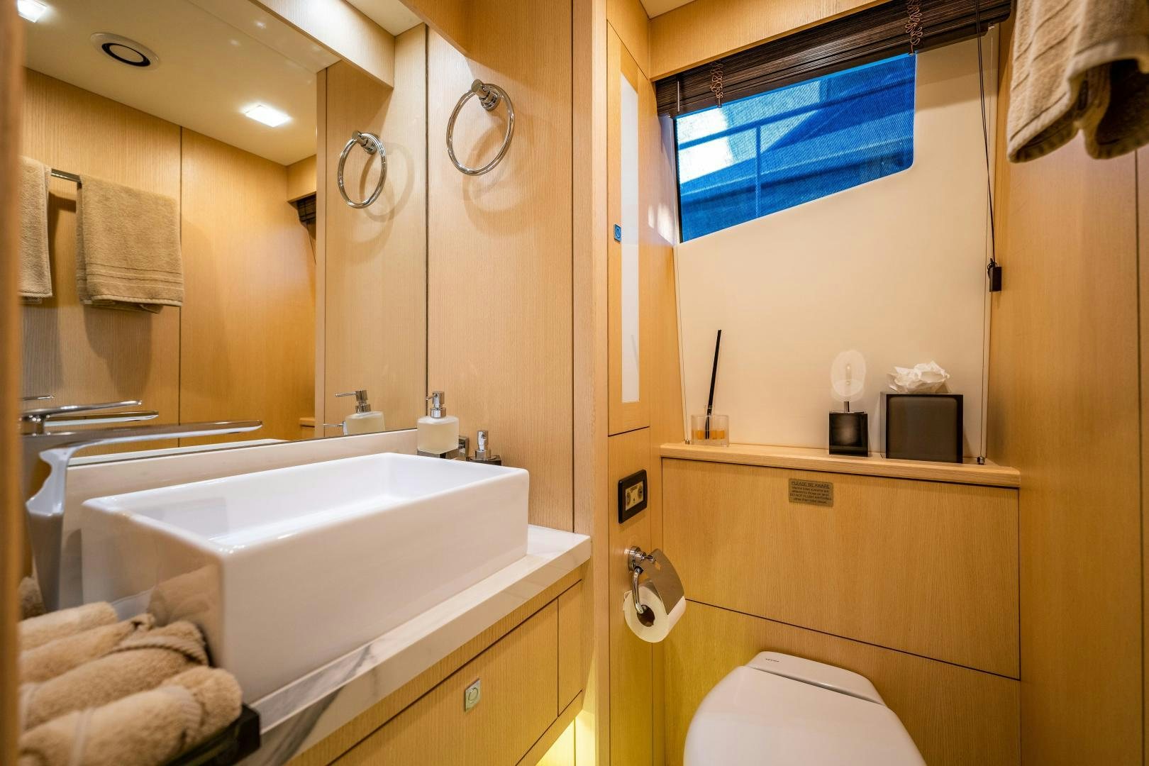 a bathroom with a tub sink and mirror aboard THE KING Yacht for Sale