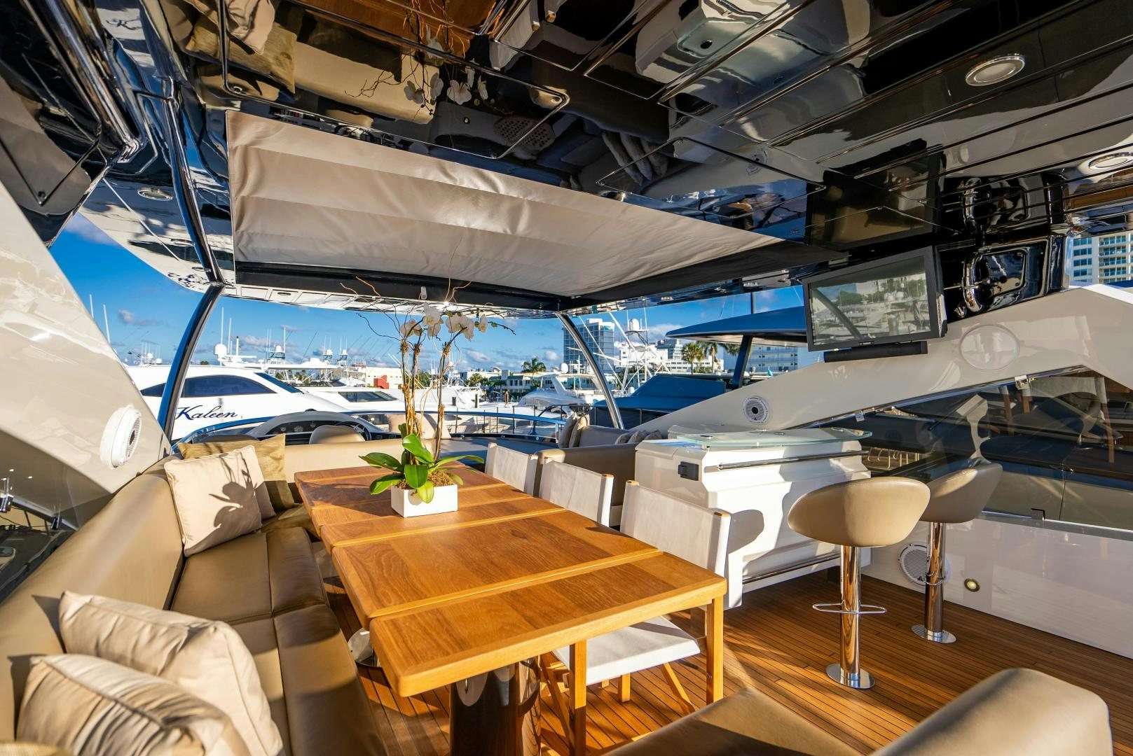 a room with a table and chairs aboard THE KING Yacht for Sale